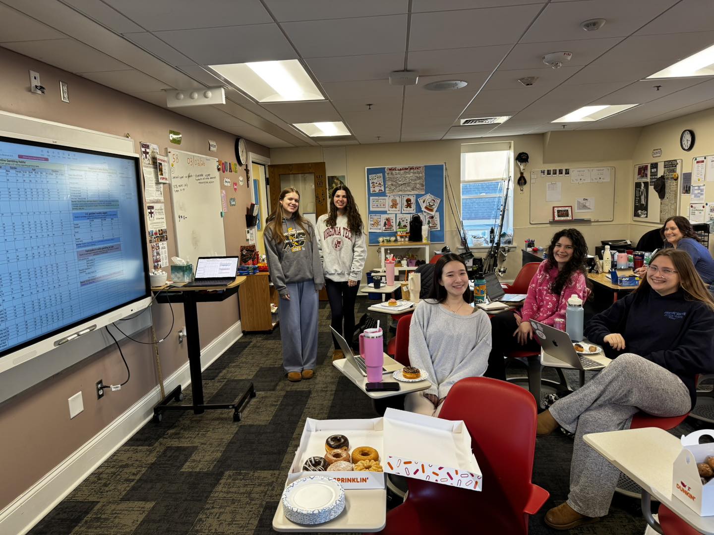 Group of students posing in classroom