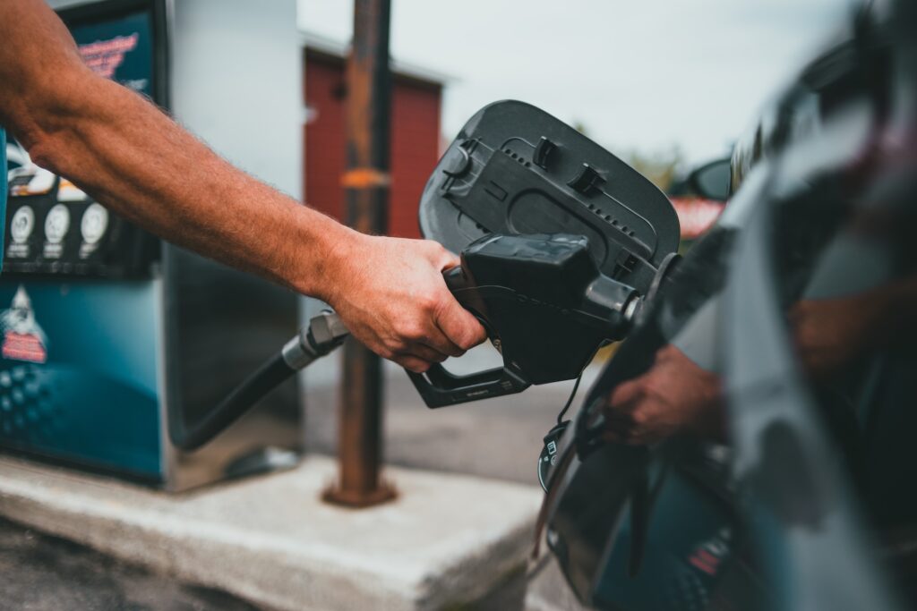 person holding black corded device