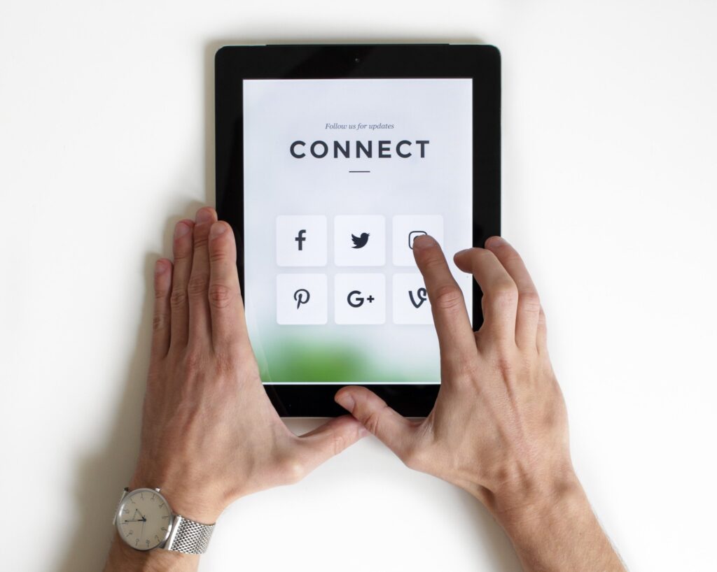 hands holding table, screen reads "CONNECT"