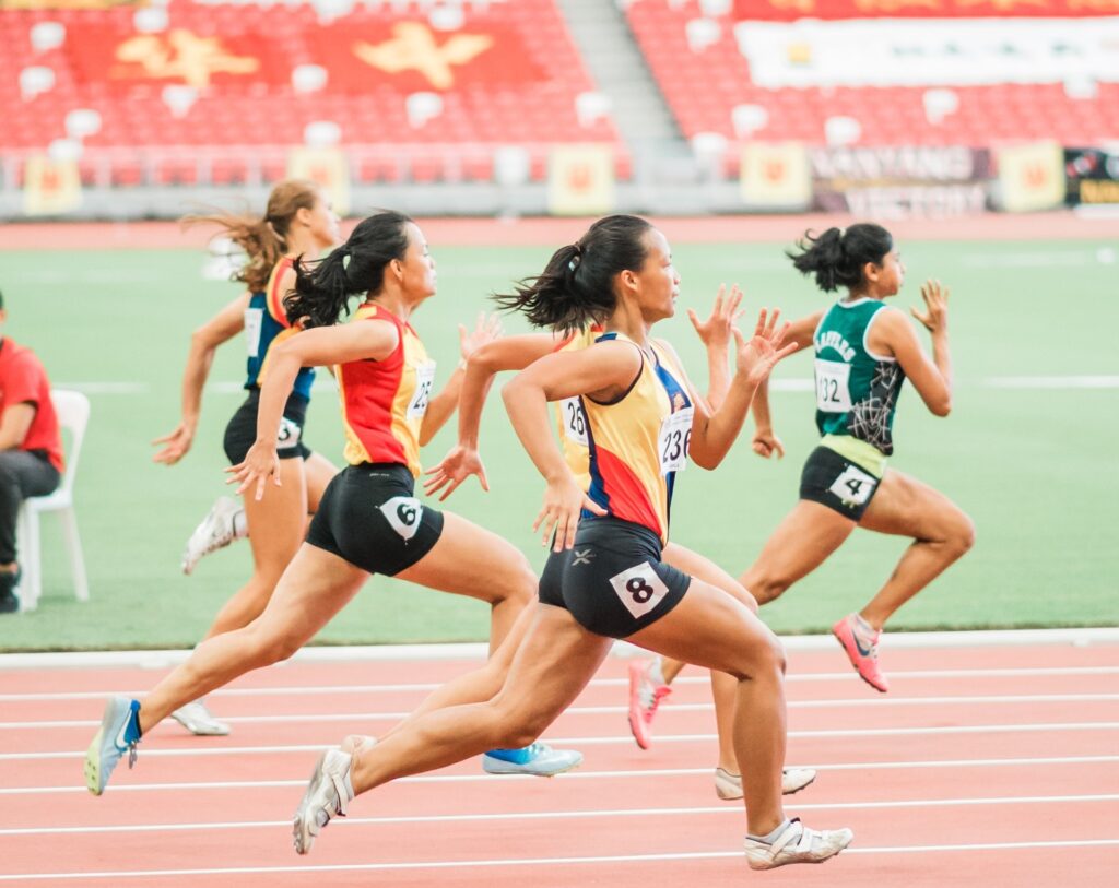 women running on track field